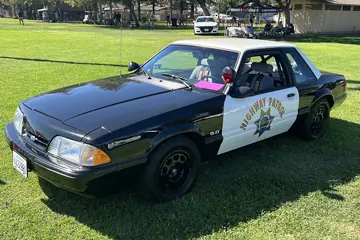 California Highway Patrol 1988 Ford Mustang in black-and-white highway patrol livery