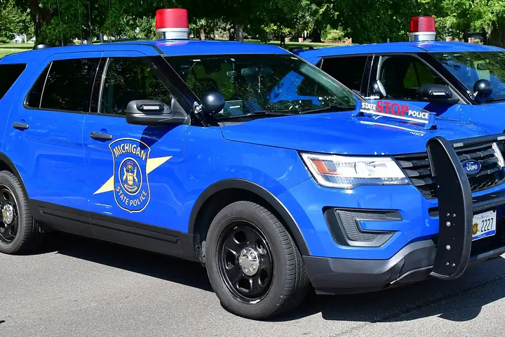 Michigan State Police Ford Police Interceptor Utility in the agency's blue livery with a single red roof light